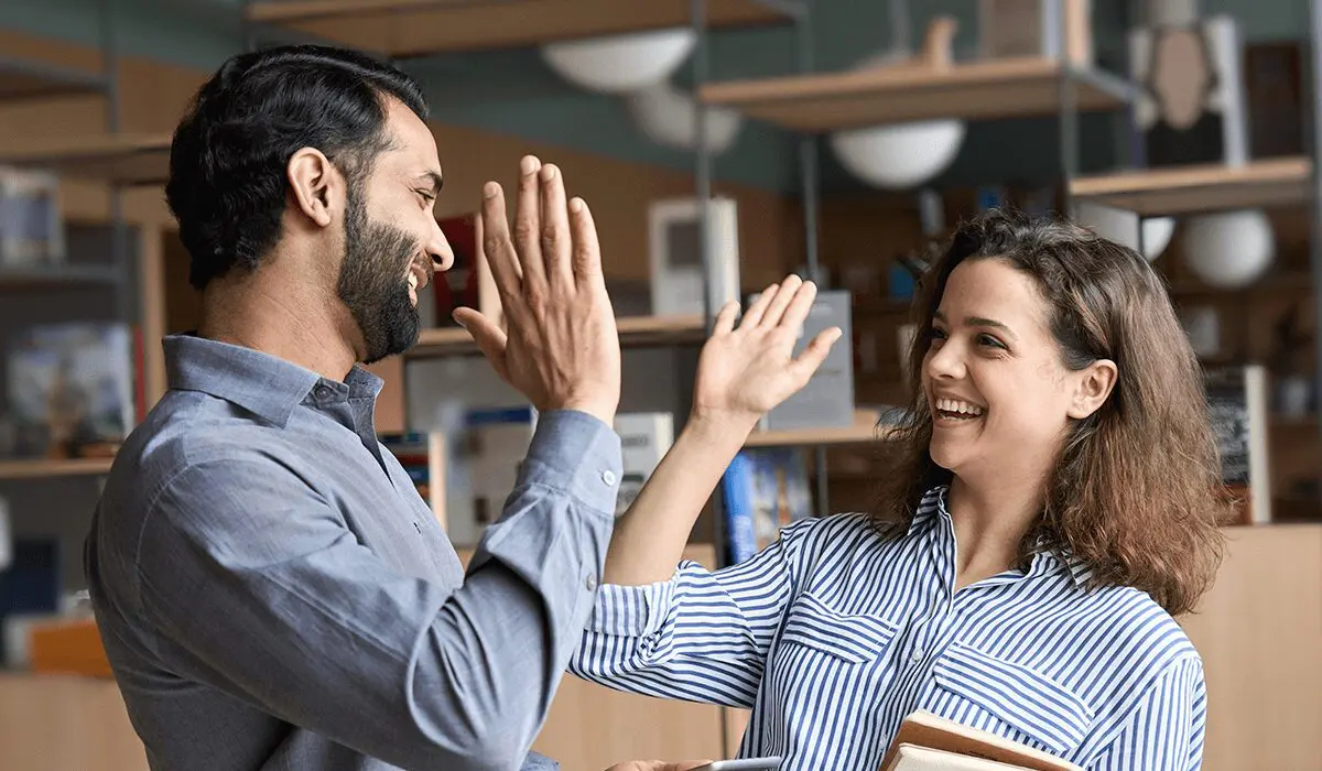 colleagues happy about using an online community engagement strategy to save time